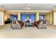 The living room features comfortable sofas, a fireplace, and tasteful decor in a stylish setting at 140 Riviera Dunes Way # 404, Palmetto, FL 34221