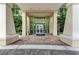 Elegant lobby entrance with a clean, spacious design, tile floors, and pristine glass doors at 140 Riviera Dunes Way # 404, Palmetto, FL 34221