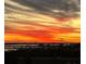 Picturesque sunset view with dramatic orange and yellow skies over the intercoastal waterway at 140 Riviera Dunes Way # 404, Palmetto, FL 34221