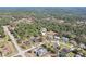 Aerial view of a neighborhood surrounded by lush greenery, showcasing the home's ideal location at 14048 Bruni Dr, Spring Hill, FL 34609
