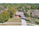 Aerial view of a single-Gathering home featuring a large lot, well-maintained landscaping, and a long driveway at 14048 Bruni Dr, Spring Hill, FL 34609