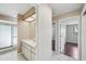 Bright bathroom featuring a sink, shower and a window for natural light at 14048 Bruni Dr, Spring Hill, FL 34609