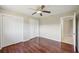 Brightly lit bedroom with a ceiling fan and pair of closets at 14048 Bruni Dr, Spring Hill, FL 34609