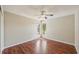 Bedroom featuring hard floors, a pair of windows, and a ceiling fan at 14048 Bruni Dr, Spring Hill, FL 34609