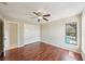 Bedroom with ceiling fan, large window overlooking pool, and closet at 14048 Bruni Dr, Spring Hill, FL 34609