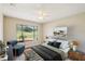 Cozy bedroom with a bright window, ceiling fan, and stylish furnishings at 14048 Bruni Dr, Spring Hill, FL 34609