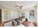 Bedroom with ceiling fan, large window overlooking pool, and closet at 14048 Bruni Dr, Spring Hill, FL 34609