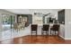 Bright kitchen featuring white cabinets, stainless steel appliances, and a breakfast bar for casual dining at 14048 Bruni Dr, Spring Hill, FL 34609