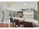 Open kitchen with counter seating and views into the dining area and the screened-in pool at 14048 Bruni Dr, Spring Hill, FL 34609