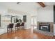 Living room featuring kitchen with bar, fireplace, and front entry at 14048 Bruni Dr, Spring Hill, FL 34609