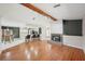 Open concept living space with hardwood floors, fireplace, and adjacent kitchen and dining areas at 14048 Bruni Dr, Spring Hill, FL 34609