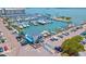 Aerial view of a marina, featuring numerous boats, parking, and bay views at 2041 Yale Ave, Dunedin, FL 34698