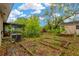 Backyard view with garden, shed, and home at 205 Sheryl Lynn Dr, Brandon, FL 33510