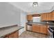 Kitchen features stainless steel appliances, stone tile backsplash and ample countertop space at 205 Sheryl Lynn Dr, Brandon, FL 33510