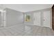 Neutral living room with tile flooring, a window, and a doorway to additional space at 205 Sheryl Lynn Dr, Brandon, FL 33510