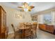 Bright dining room featuring a wooden table, comfortable chairs, and ample natural light at 2379 Finlandia Ln # 21, Clearwater, FL 33763