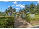 Community dog park with gated entry, shelter, and lush landscaping at 2379 Finlandia Ln # 21, Clearwater, FL 33763