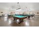 Spacious game room with multiple billiard tables and overhead lighting at 2379 Finlandia Ln # 21, Clearwater, FL 33763