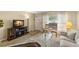 Cozy living room with a decorative fireplace, wood-look floors, and comfortable seating area at 2379 Finlandia Ln # 21, Clearwater, FL 33763