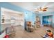 Inviting living room open to a kitchen, light-blue walls, and stylish wood-look floors at 2379 Finlandia Ln # 21, Clearwater, FL 33763