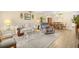 Inviting living room featuring a comfortable sofa, glass table, and a bright, airy ambiance at 2379 Finlandia Ln # 21, Clearwater, FL 33763