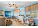 Bright living room with beach-themed decorations, a unique ceiling fan, and natural light at 2379 Finlandia Ln # 21, Clearwater, FL 33763