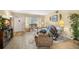 Comfortable living room with a decorative fireplace, plush seating, and a welcoming ambiance at 2379 Finlandia Ln # 21, Clearwater, FL 33763