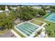 Outdoor shuffleboard court with benches surrounded by trees and landscaping at 2379 Finlandia Ln # 21, Clearwater, FL 33763