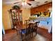 Dining room featuring a wooden table with adjacent pass-through bar to kitchen at 30 Woodridge Cir, Oldsmar, FL 34677