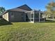 Home featuring a screened lanai, providing a perfect outdoor living space at 30142 Sotogrande Loop, Wesley Chapel, FL 33543
