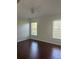 Bedroom with wood floors and natural light at 30142 Sotogrande Loop, Wesley Chapel, FL 33543
