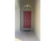 Elegant front door with transom window providing inviting curb appeal at 30142 Sotogrande Loop, Wesley Chapel, FL 33543