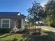 Well-manicured lawn and landscaping enhance the curb appeal of this charming home at 30142 Sotogrande Loop, Wesley Chapel, FL 33543