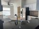 Bright kitchen area boasts stainless steel appliances and views of the adjacent laundry room at 30142 Sotogrande Loop, Wesley Chapel, FL 33543