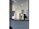 Open kitchen area boasts stainless steel appliances and views of the adjacent rooms at 30142 Sotogrande Loop, Wesley Chapel, FL 33543