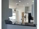 Open kitchen area boasts stainless steel appliances and views of the adjacent laundry room at 30142 Sotogrande Loop, Wesley Chapel, FL 33543