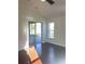 Living room with slider access to the screened lanai and backyard at 30142 Sotogrande Loop, Wesley Chapel, FL 33543