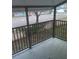 Relax on this charming balcony with black metal railings overlooking a busy street at 3801 N Oak Dr # A62, Tampa, FL 33611