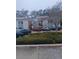 Multi-Gathering two-story residential complex with parking area, landscaping, and stairway access at 3801 N Oak Dr # A62, Tampa, FL 33611