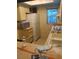 Kitchen with a refrigerator, sink and counter that require renovation at 3801 N Oak Dr # A62, Tampa, FL 33611