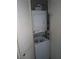 Practical laundry closet equipped with a stacked washer and dryer unit at 3801 N Oak Dr # A62, Tampa, FL 33611