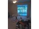 Inviting living room showcasing a sliding glass door, a ceiling fan, and tile flooring at 3801 N Oak Dr # A62, Tampa, FL 33611