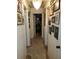 Hallway with doors and a chandelier, walls covered in Gathering photos at 4202 W Bay Vista Ave, Tampa, FL 33611