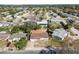 Aerial view of a home with a big front yard and a neighboring community at 4209 Westwood Dr, Holiday, FL 34691