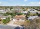 Aerial view of a home with a big front yard and a neighboring community at 4209 Westwood Dr, Holiday, FL 34691