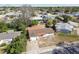 Aerial view of a home with a big front yard and a neighboring community at 4209 Westwood Dr, Holiday, FL 34691