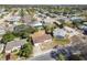 Neighborhood view featuring a single-Gathering home with a community pool, mature trees, and a residential street at 4209 Westwood Dr, Holiday, FL 34691