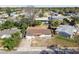 Aerial view of a home with a big front yard and a neighboring community at 4209 Westwood Dr, Holiday, FL 34691
