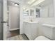 Clean bathroom showcasing a white vanity, modern fixtures, and tile flooring, offering a fresh look at 4209 Westwood Dr, Holiday, FL 34691
