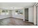 Bedroom with hardwood floors, lots of windows, and a closet at 4209 Westwood Dr, Holiday, FL 34691